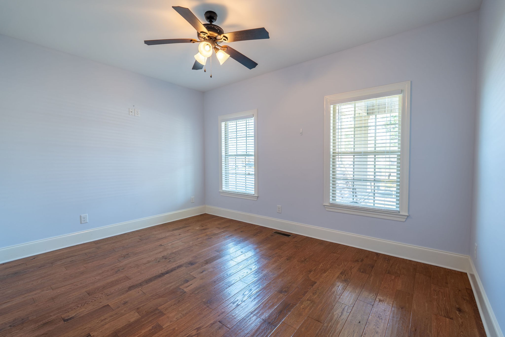 219 Waterloo Street Lawrenceburg, TN 38464 - Photo 22 of 39 a view of an empty room with wooden floor and a window