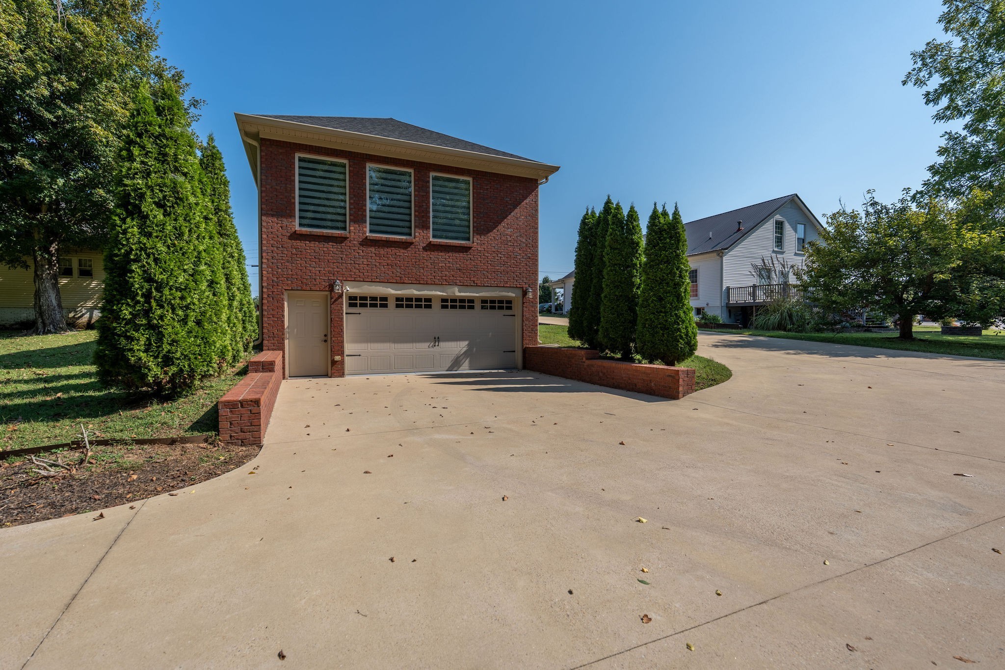 219 Waterloo Street Lawrenceburg, TN 38464 - Photo 29 of 39 a front view of a house with plants