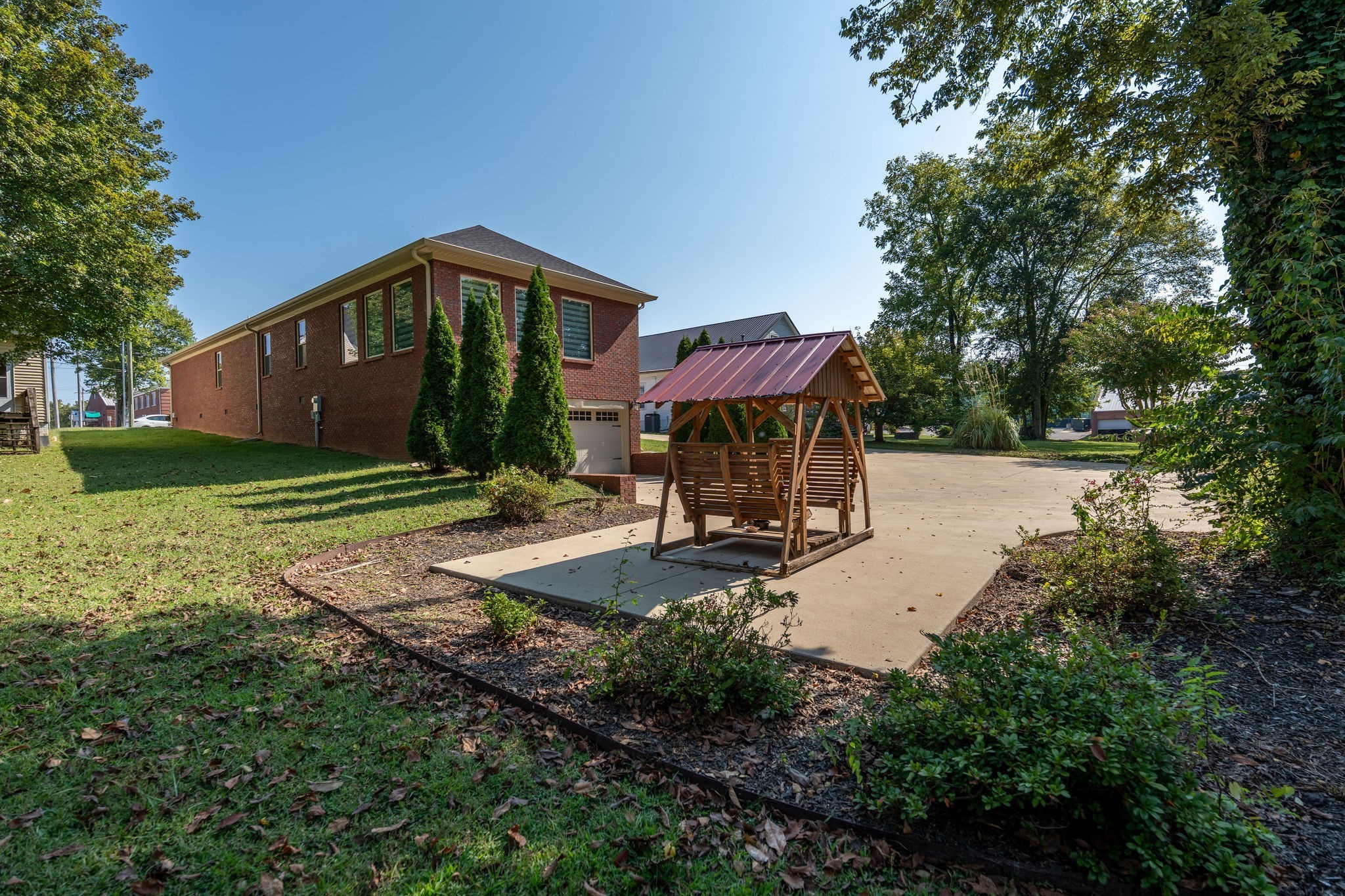 219 Waterloo Street Lawrenceburg, TN 38464 - Photo 30 of 39 a view of a house with backyard and sitting area
