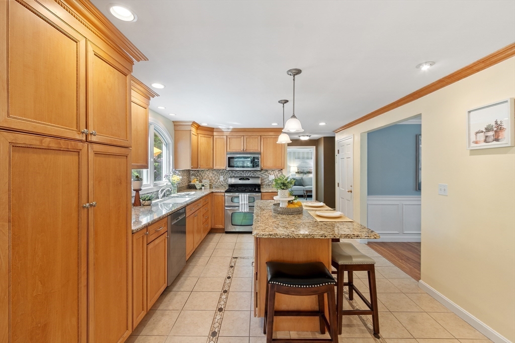 2 Pomfret Road Chelmsford, MA 01824 - Photo 11 of 38 a large kitchen with a table and chairs
