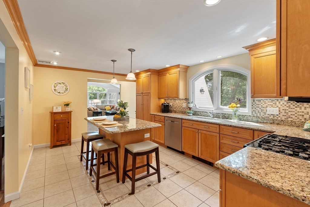 2 Pomfret Road Chelmsford, MA 01824 - Photo 12 of 38 a kitchen with stainless steel appliances a sink a counter top space and a large window