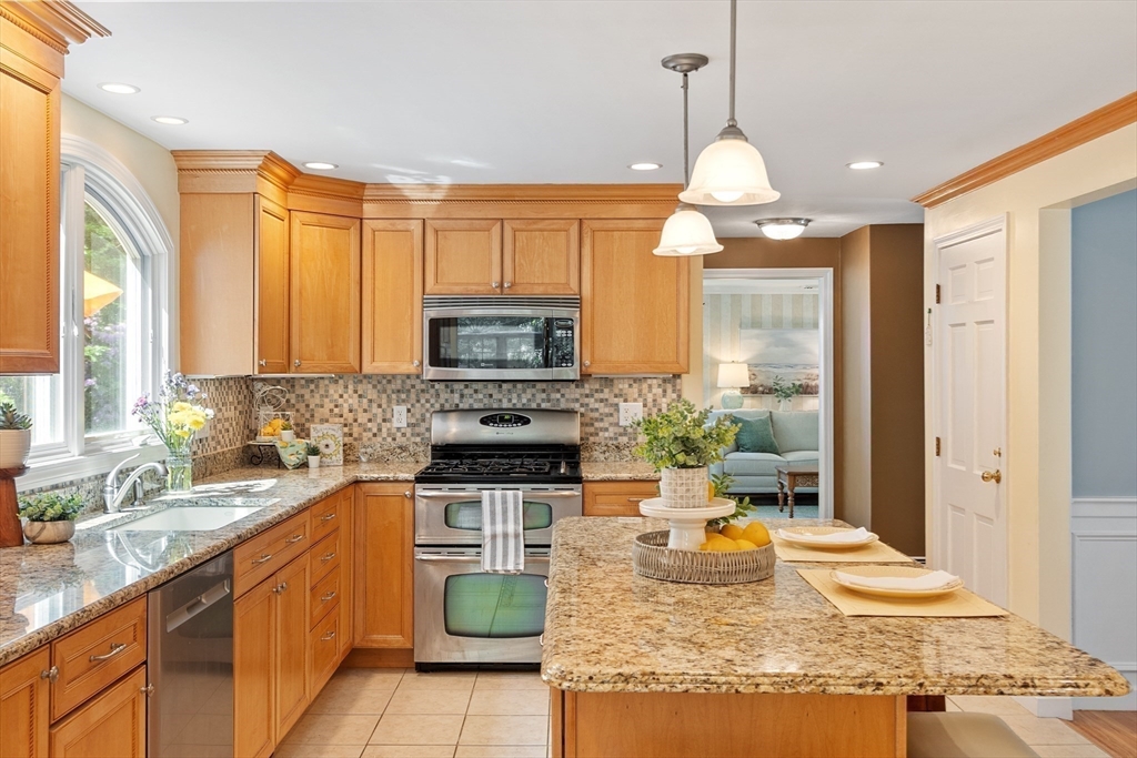 2 Pomfret Road Chelmsford, MA 01824 - Photo 13 of 38 a kitchen with a stove a sink and a refrigerator