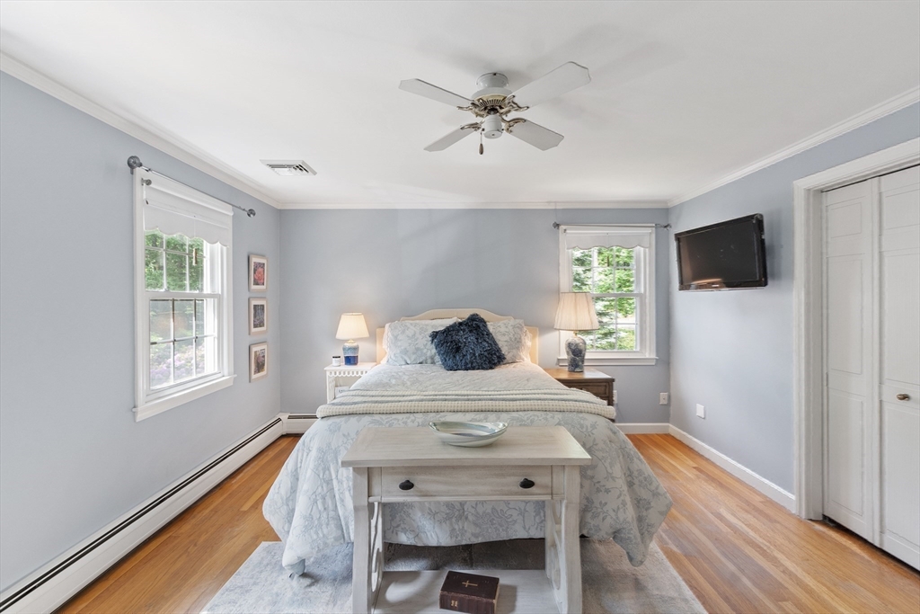 2 Pomfret Road Chelmsford, MA 01824 - Photo 24 of 38 a bedroom with a bed and a chandelier