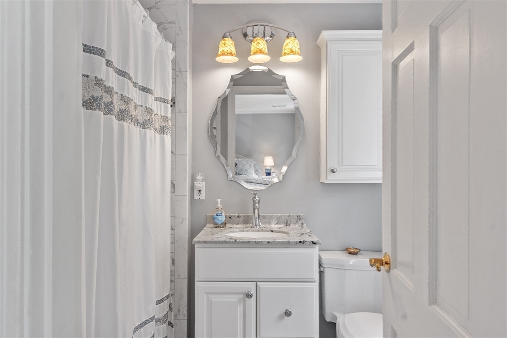 2 Pomfret Road Chelmsford, MA 01824 - Photo 25 of 38 a bathroom with a sink a mirror and a toilet