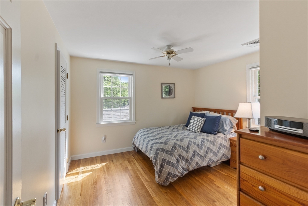 2 Pomfret Road Chelmsford, MA 01824 - Photo 26 of 38 a bedroom with a bed and wooden floor