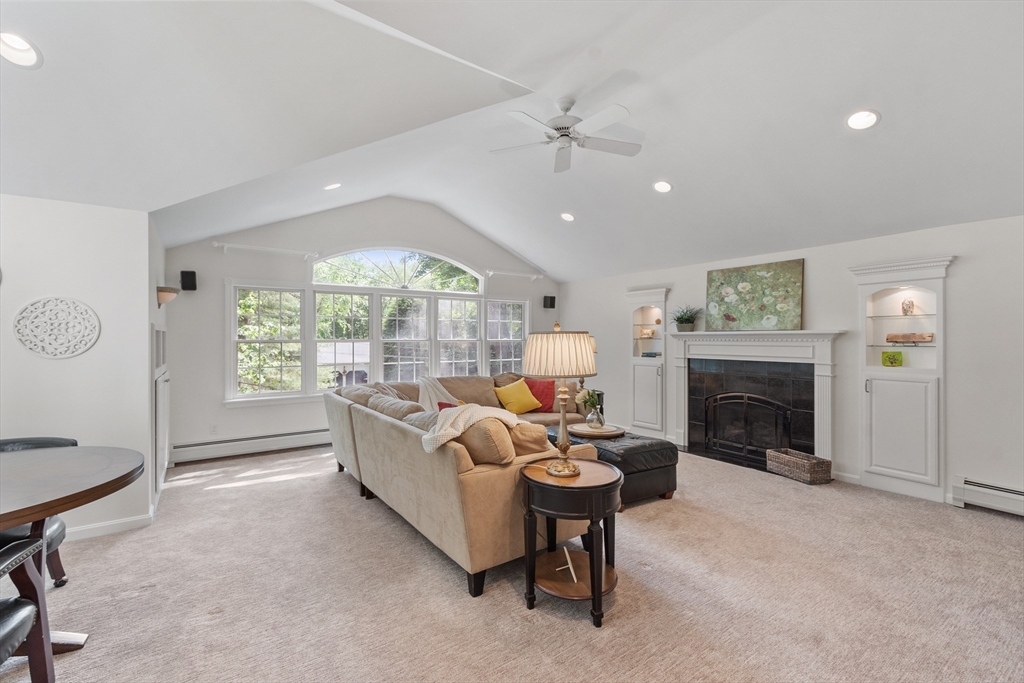 2 Pomfret Road Chelmsford, MA 01824 - Photo 3 of 38 a living room with furniture a fireplace and a large window