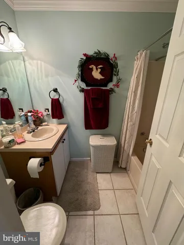 a bathroom with a sink toilet and mirror