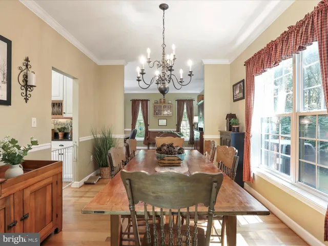 a kitchen with white cabinets stainless steel appliances and a counter top space