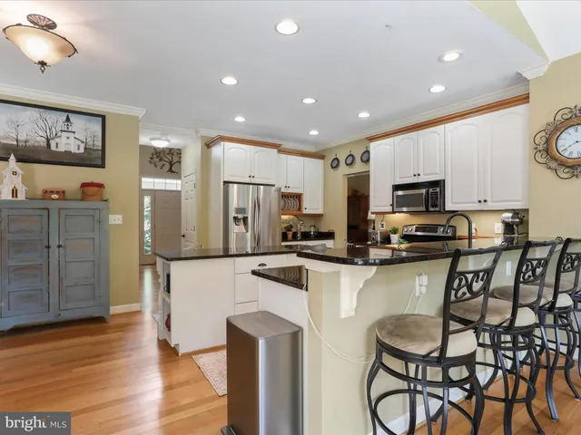 a view of a livingroom with furniture and a flat screen tv
