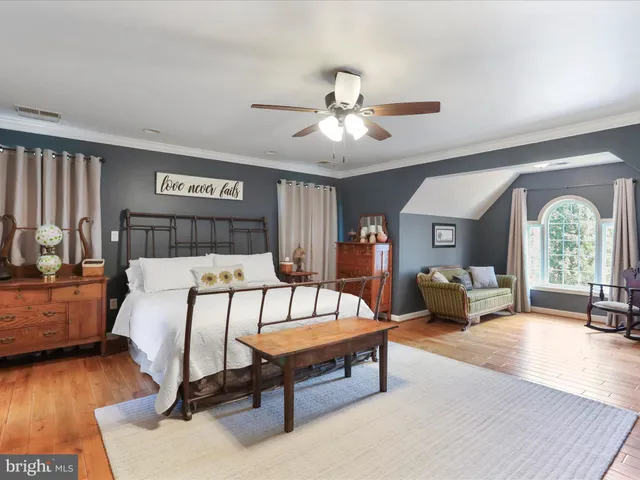 a bedroom with a bed and dresser