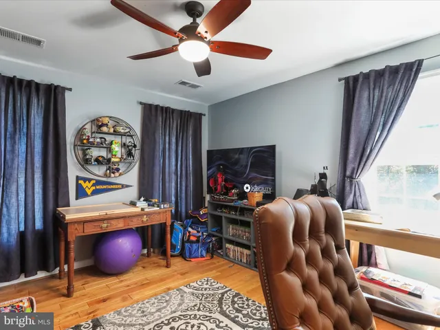 a view of a swimming pool with outdoor seating