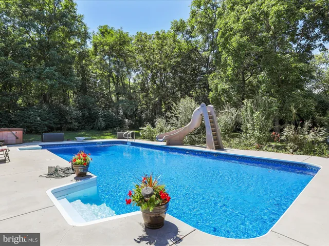 a view of a outdoor space with a swimming pool