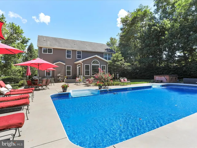 a kitchen with lots of counter top space appliances and a large window