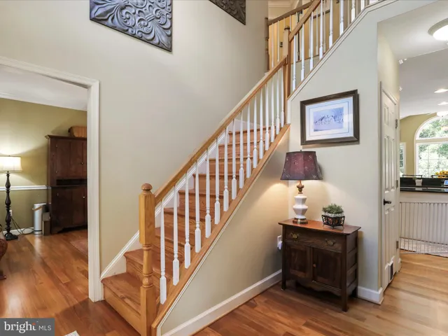 a bathroom with a sink mirror and toilet