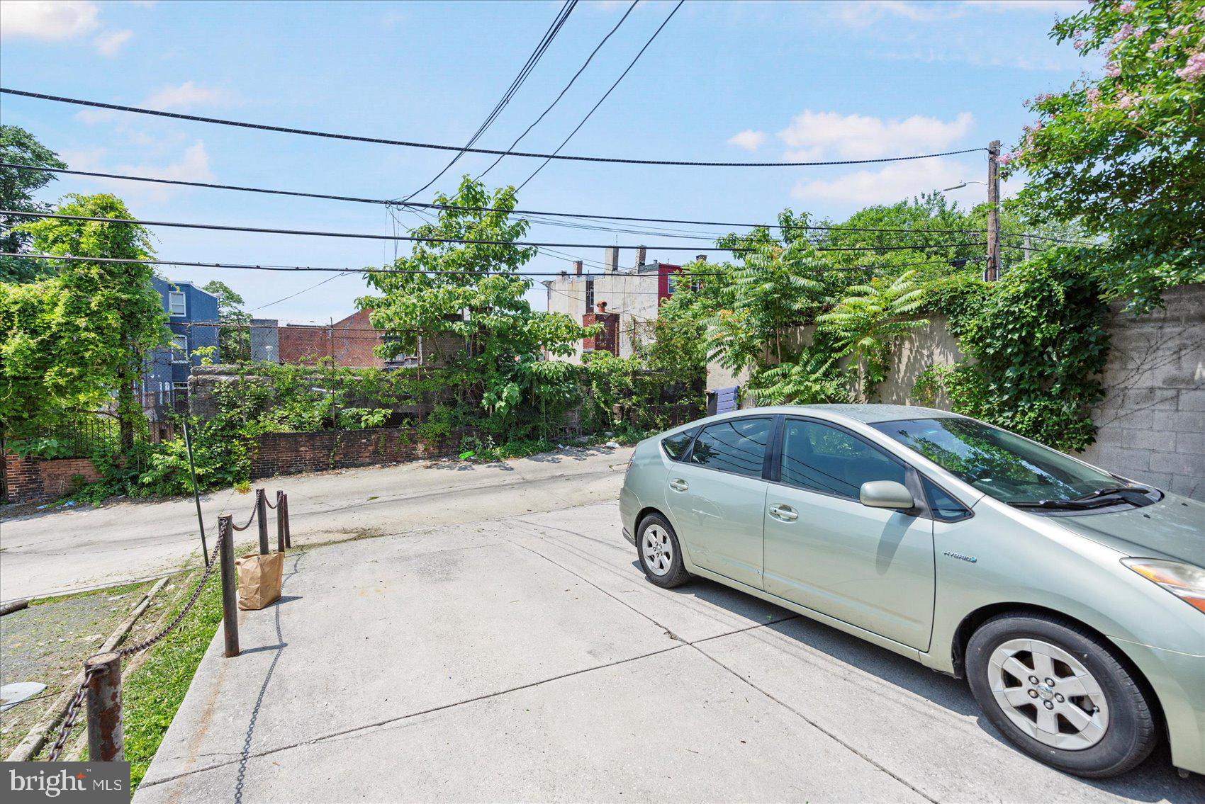 2304 Eutaw Place Baltimore, MD 21217 - Photo 98 of 105 a view of a car parked in front of a house