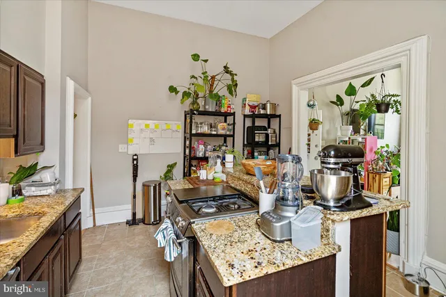 a bath tub sitting next to a white sink and a shower