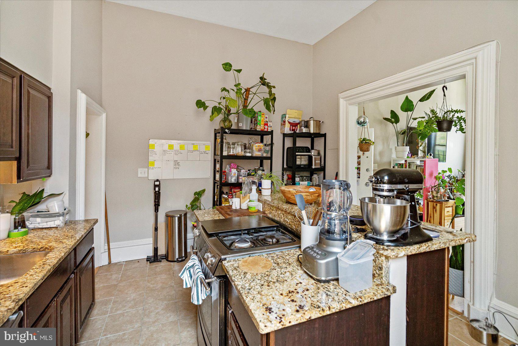 2304 Eutaw Place Baltimore, MD 21217 - Photo 11 of 105 a kitchen with a stove and a refrigerator