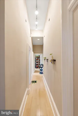 a bedroom with a bed and a mirror