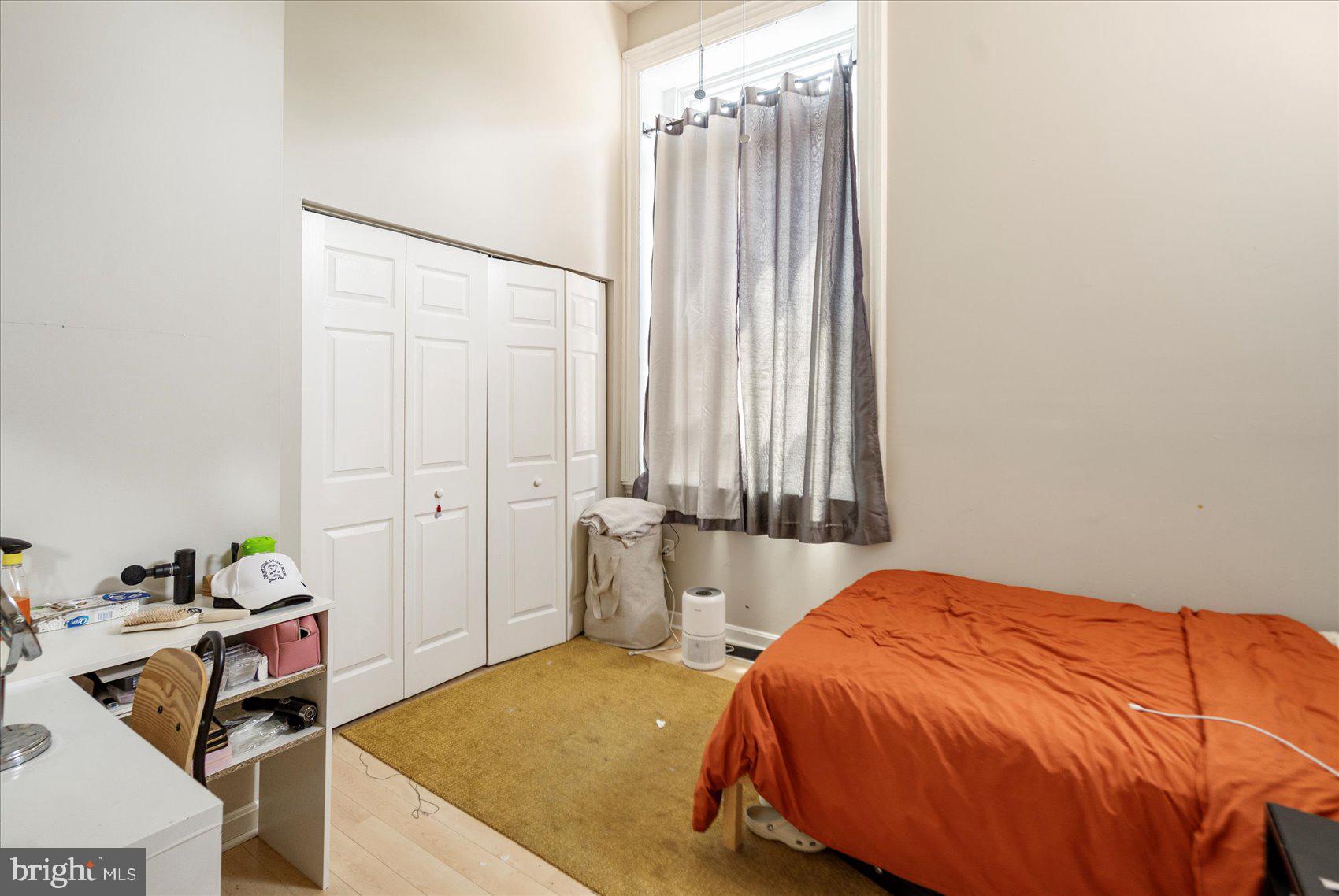 2304 Eutaw Place Baltimore, MD 21217 - Photo 15 of 105 a bedroom with a bed and a table in it