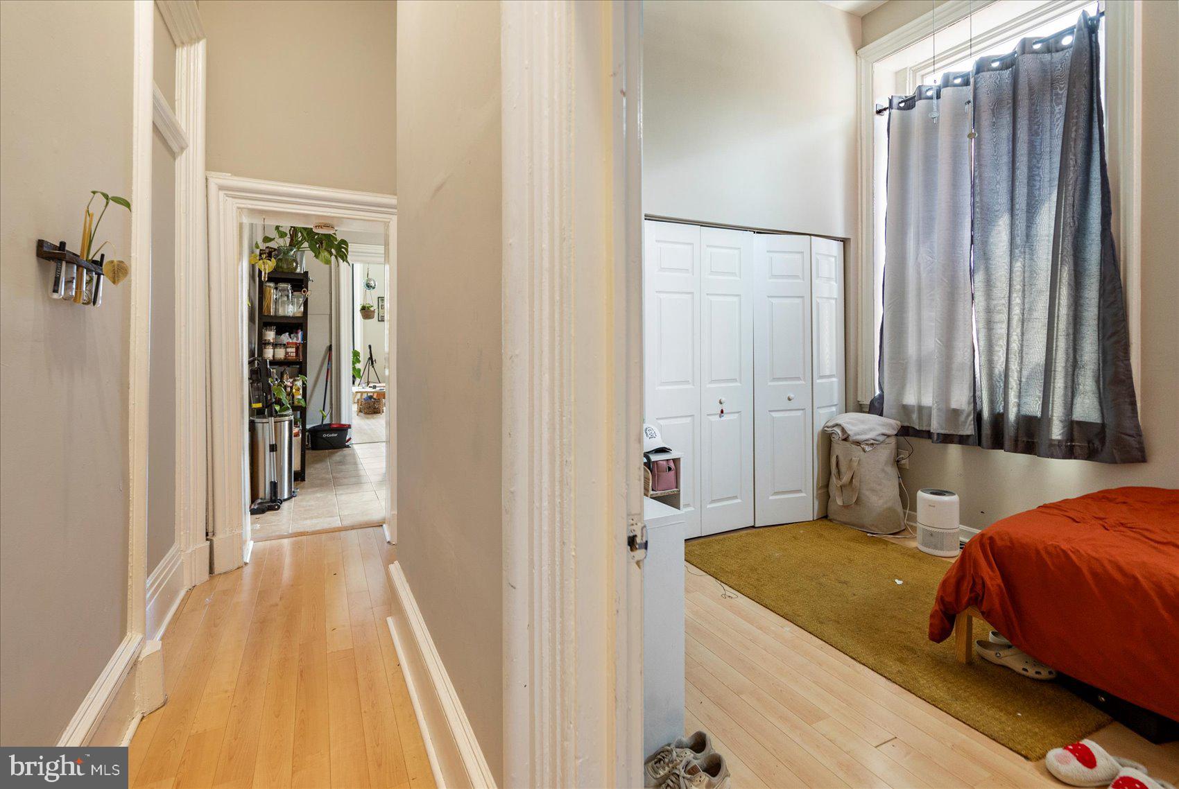 2304 Eutaw Place Baltimore, MD 21217 - Photo 21 of 105 a bedroom with a bed and a mirror