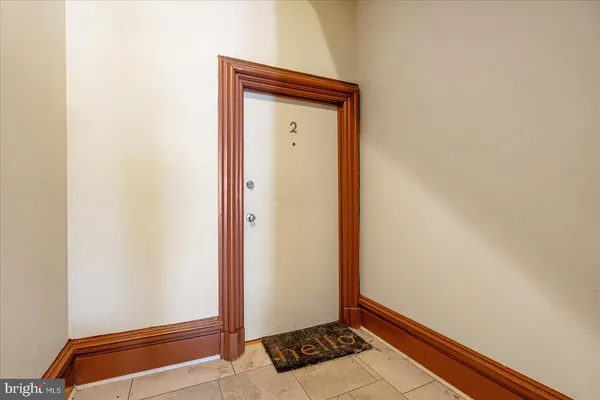 a bedroom with double bed and a window