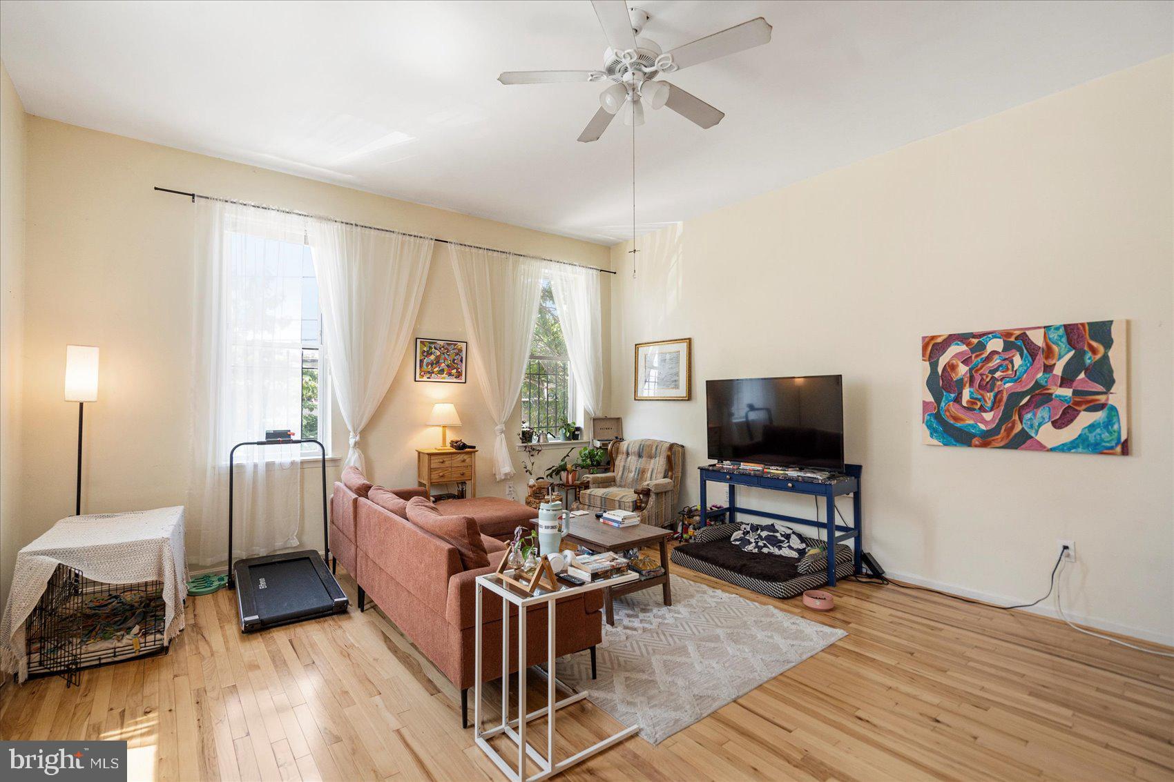 2304 Eutaw Place Baltimore, MD 21217 - Photo 27 of 105 a living room with furniture and a flat screen tv