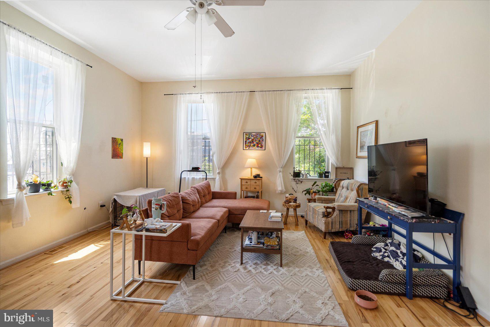 2304 Eutaw Place Baltimore, MD 21217 - Photo 28 of 105 a living room with furniture and a flat screen tv