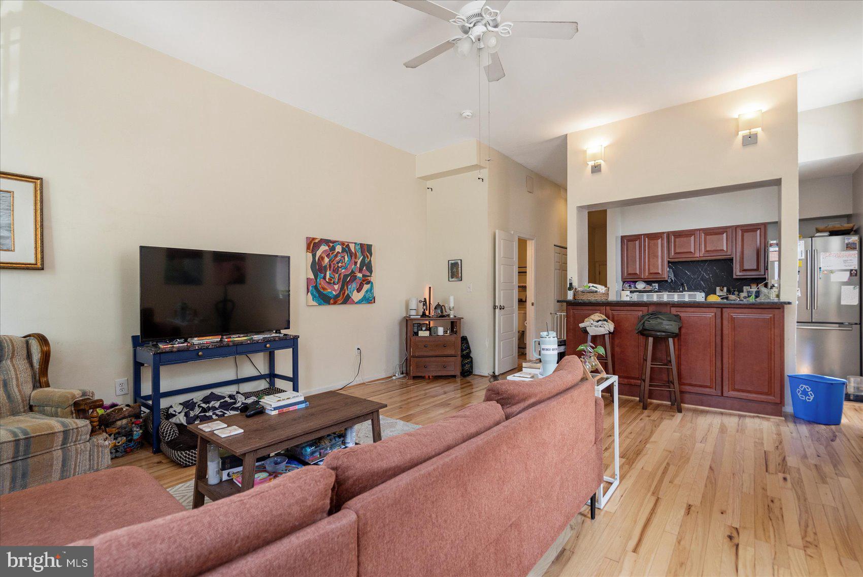 2304 Eutaw Place Baltimore, MD 21217 - Photo 29 of 105 a living room with furniture and a flat screen tv