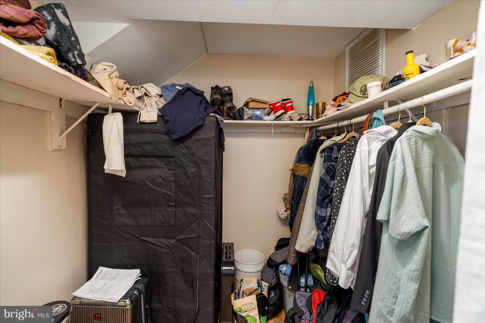 2304 Eutaw Place Baltimore, MD 21217 - Photo 40 of 105 a view of walk in closet with clothes and shoes