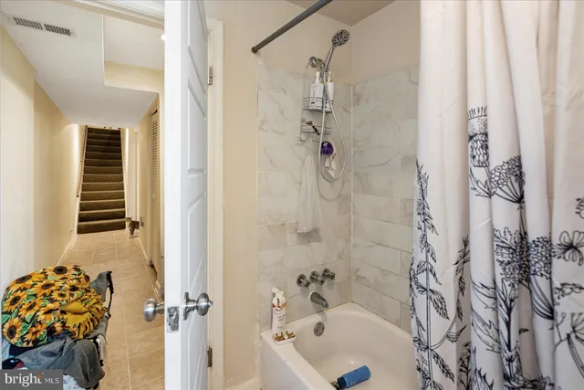 a room with gym equipment and a large window