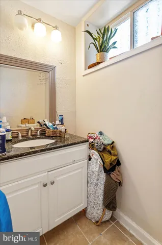 a bathroom with a sink a toilet and bathtub