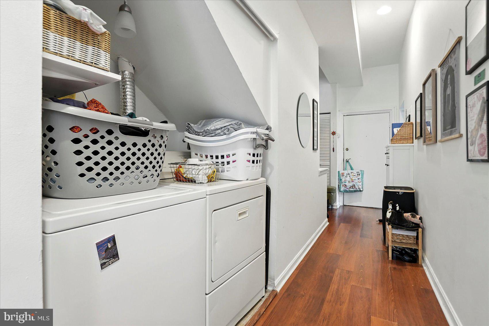 2304 Eutaw Place Baltimore, MD 21217 - Photo 47 of 105 a kitchen with granite countertop a refrigerator a stove and wooden floor