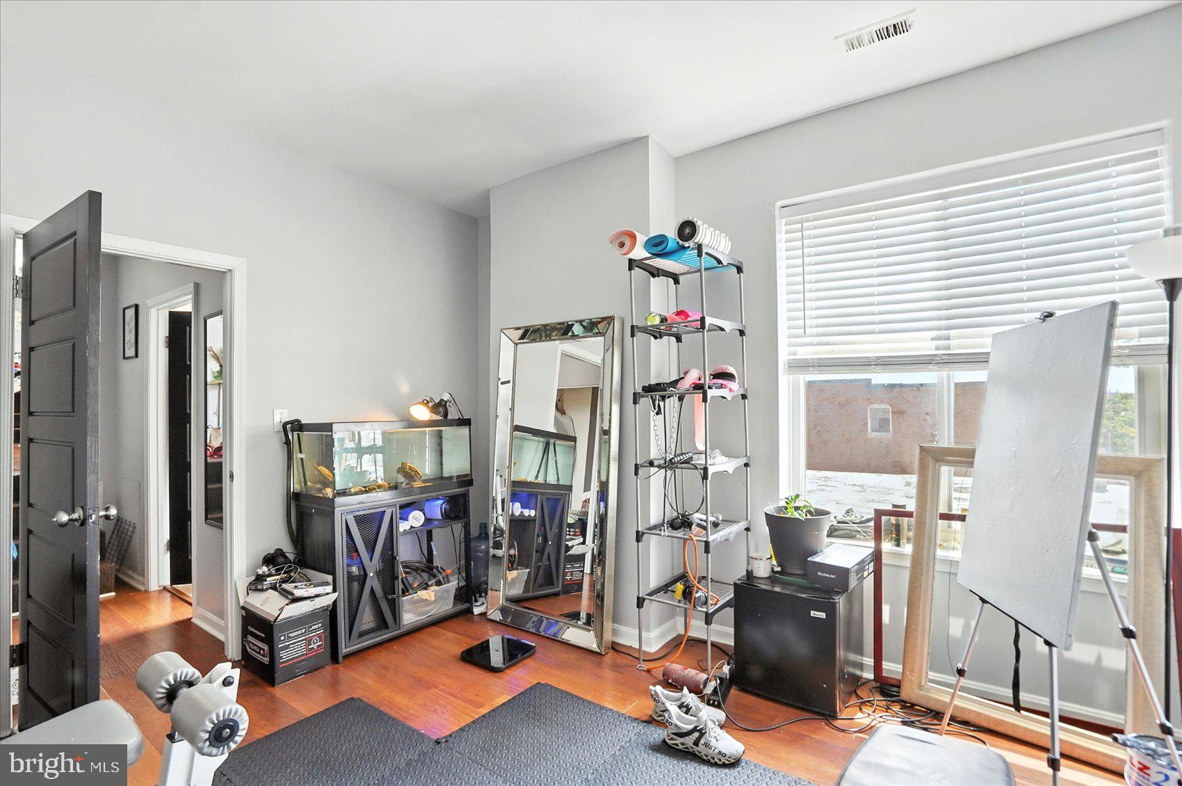 2304 Eutaw Place Baltimore, MD 21217 - Photo 82 of 105 a room with gym equipment and a large window
