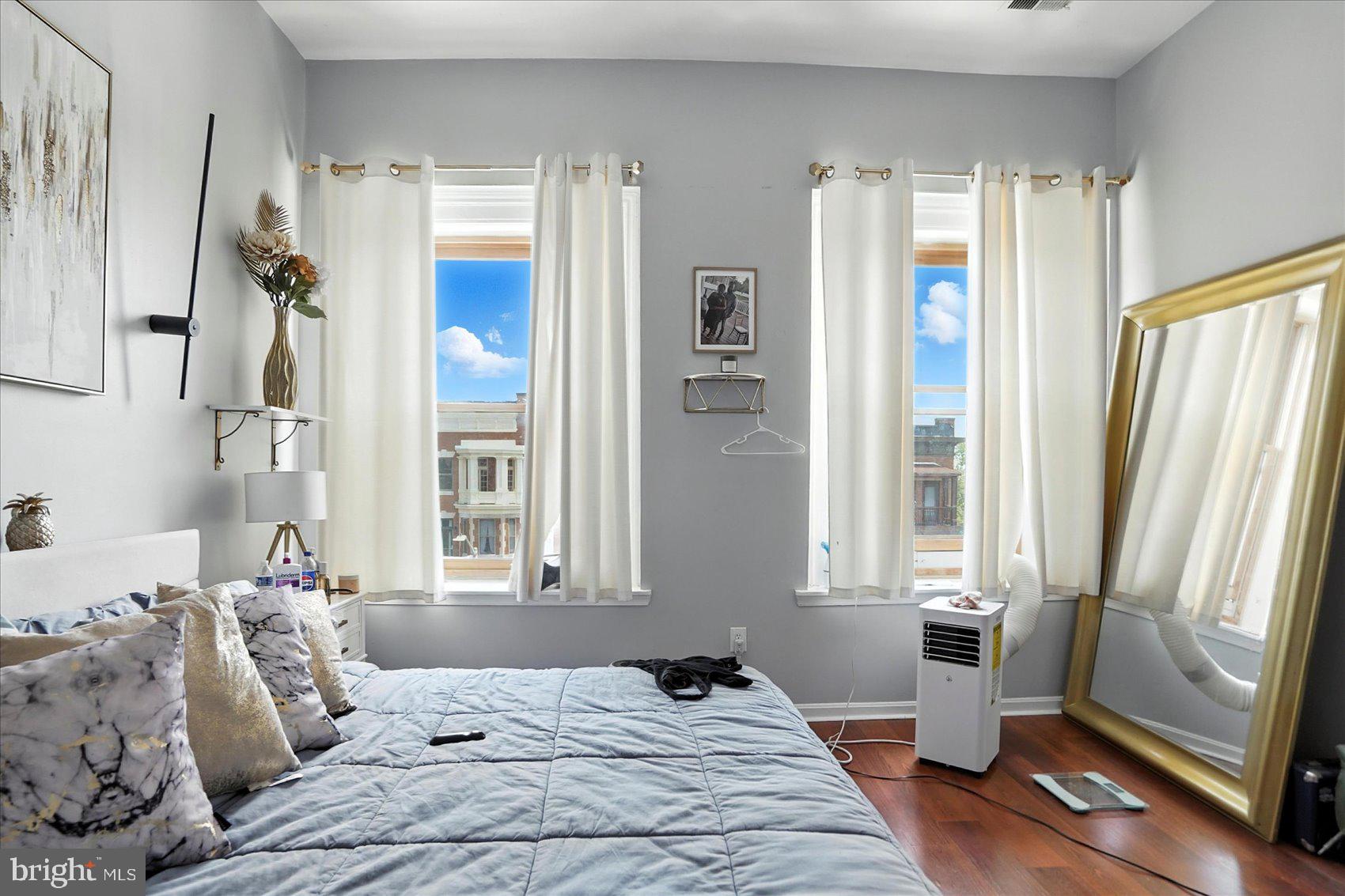 2304 Eutaw Place Baltimore, MD 21217 - Photo 87 of 105 a bedroom with a large bed and a window