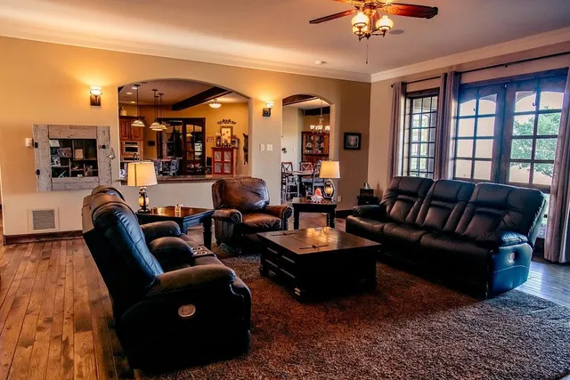 a living room with furniture and a large window