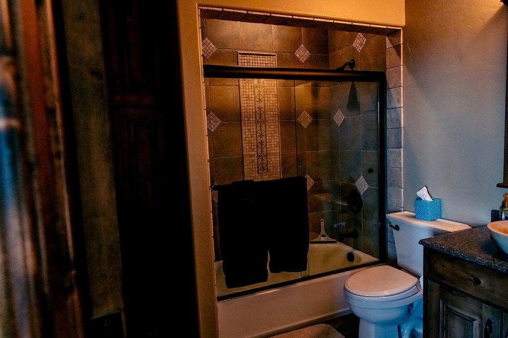 1230 Ridgeview Rangely, CO 81648 - Photo 16 of 42 a bathroom with a toilet and a shower