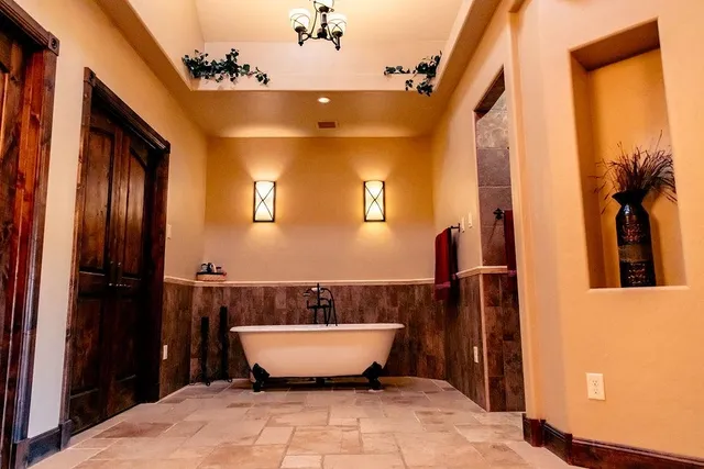 a view of bathroom with a bathtub and shower