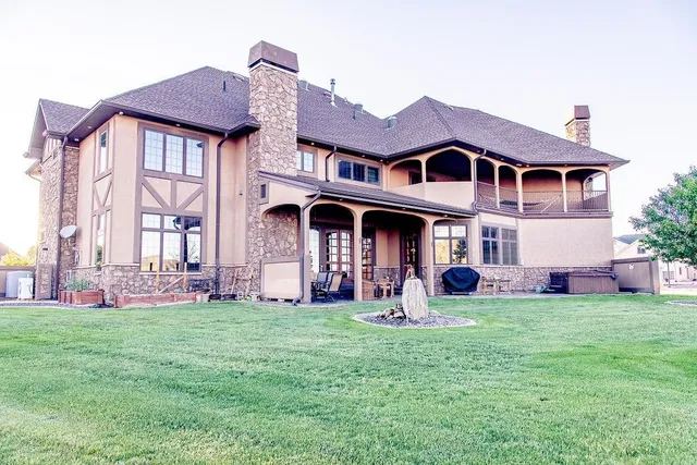 a front view of a house with a yard and porch