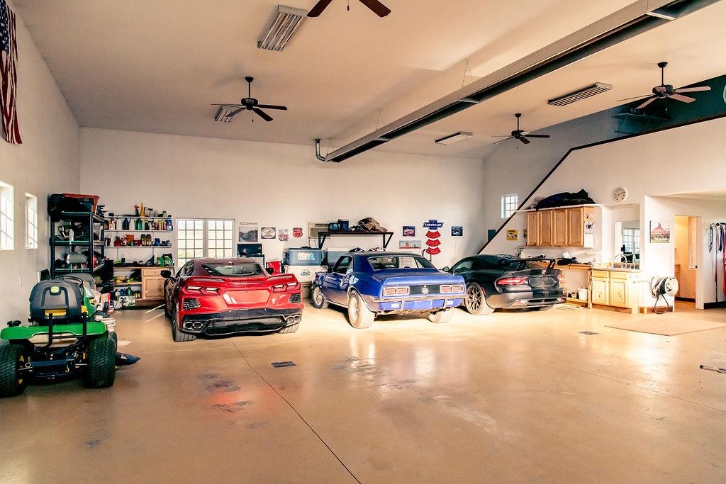 1230 Ridgeview Rangely, CO 81648 - Photo 38 of 42 a living room with lots of furniture and a chandelier