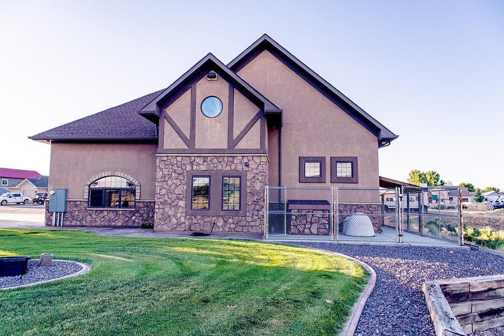 1230 Ridgeview Rangely, CO 81648 - Photo 4 of 42 a front view of a house with a yard
