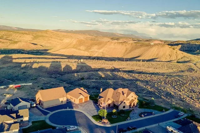 an aerial view of a house swimming pool and outdoor seating