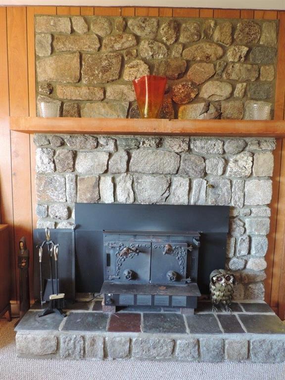 Custom fieldstone fireplace with...