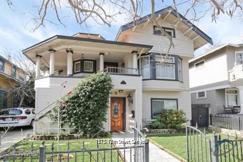 187 South 12th Street, Unit 2 San Jose, CA 95112 - Photo 1 of 24 a view of a white house with large windows and a table and chairs