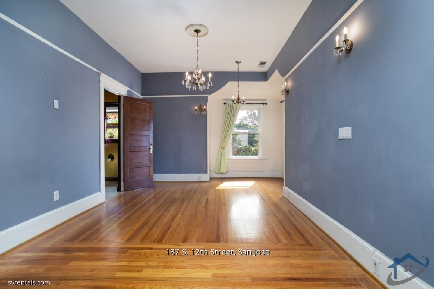 187 South 12th Street, Unit 2 San Jose, CA 95112 - Photo 11 of 24 a view of an empty room with window and wooden floor