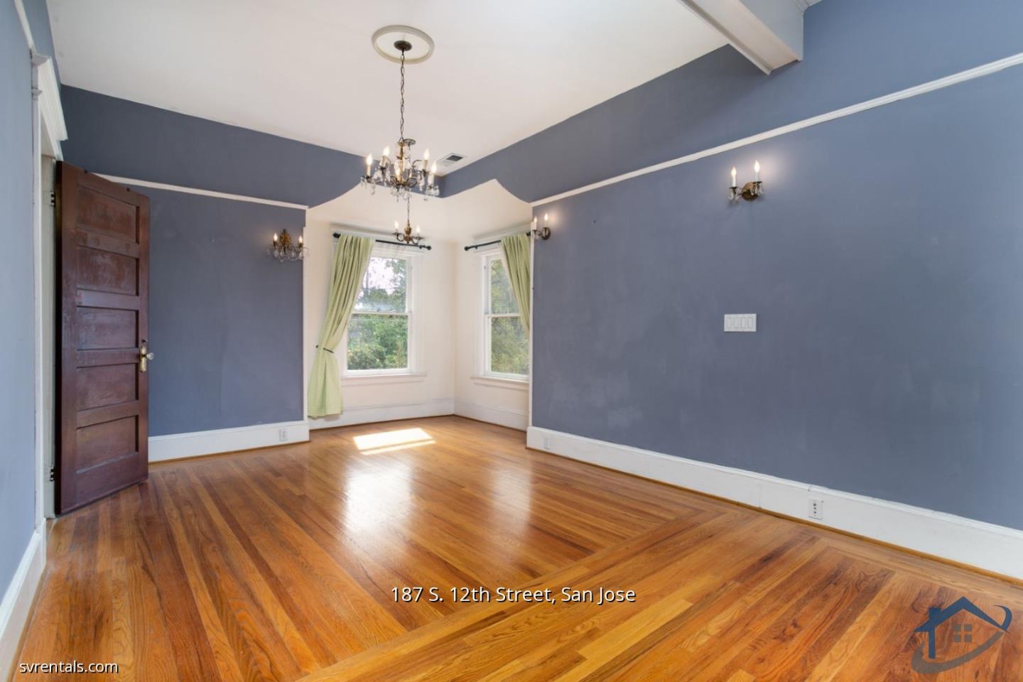 187 South 12th Street, Unit 2 San Jose, CA 95112 - Photo 13 of 24 a view of an empty room with wooden floor and a window