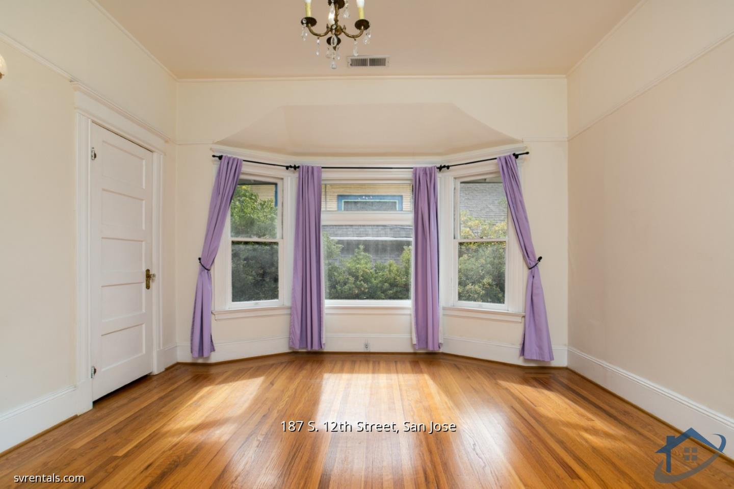 187 South 12th Street, Unit 2 San Jose, CA 95112 - Photo 18 of 24 an empty room with wooden floor and windows