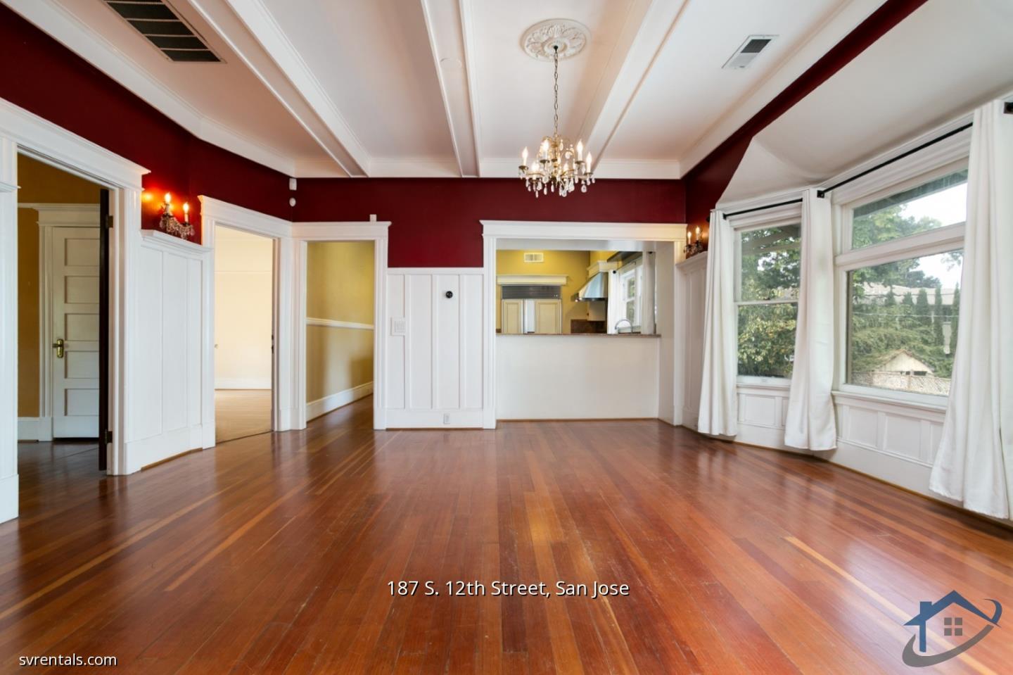 187 South 12th Street, Unit 2 San Jose, CA 95112 - Photo 4 of 24 a view of an empty room with wooden floor and a window