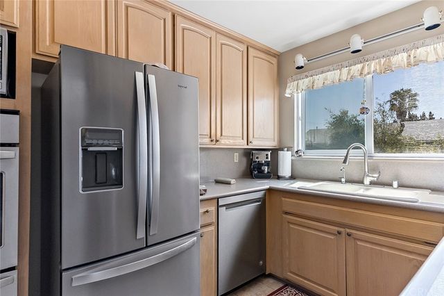 a bathroom with a double vanity sink toilet mirror and shower