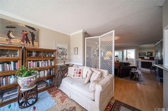 a living room with furniture and a book shelf