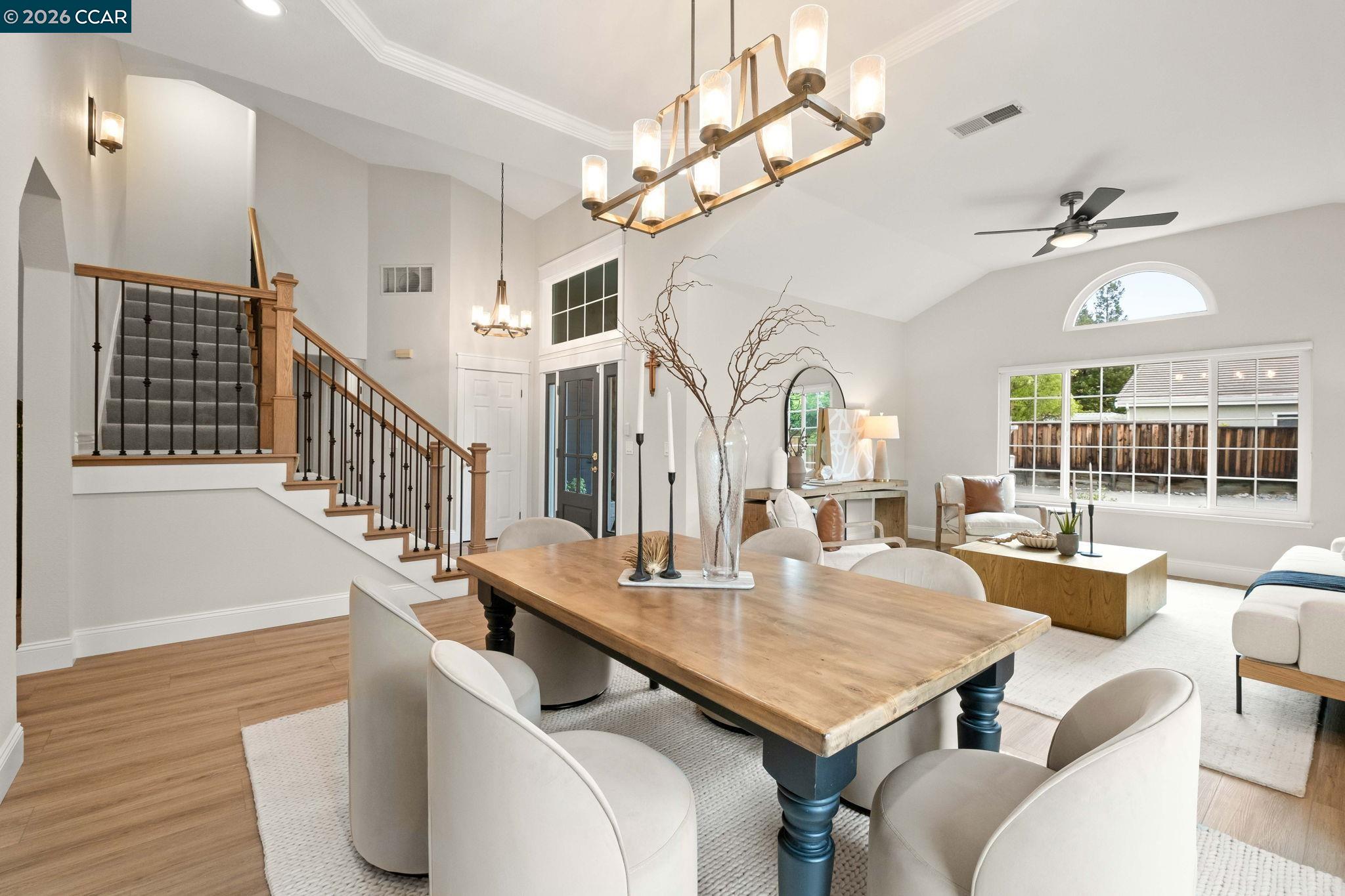 76 Rock Ridge Court Danville, CA 94526 - Photo 13 of 65 a living room with furniture a chandelier and a dining table
